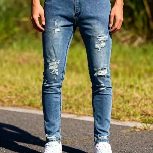 Men‘s Distressed Denim Jeans | Faded Light Blue Slim Tapered Pants | Ripped Details on Knees and Thighs, Raw Edge Finish