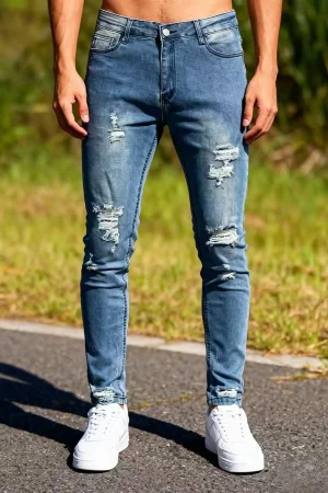 Men‘s Distressed Denim Jeans | Faded Light Blue Slim Tapered Pants | Ripped Details on Knees and Thighs, Raw Edge Finish